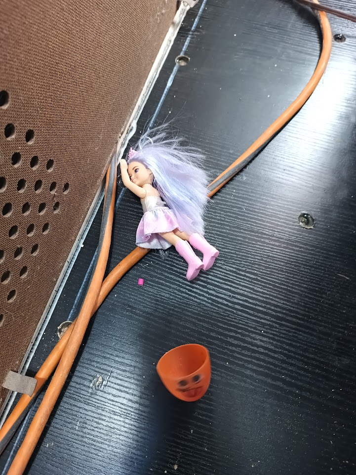 A small doll found inside the organ cabinet
